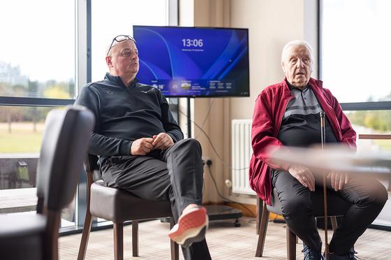 Two guests chatting in the clubhouse lounge
